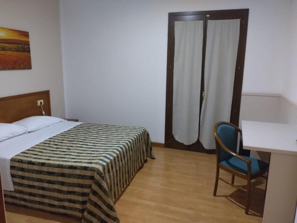 Postel nebo postele na pokoji v ubytování Hotel Nicolaj