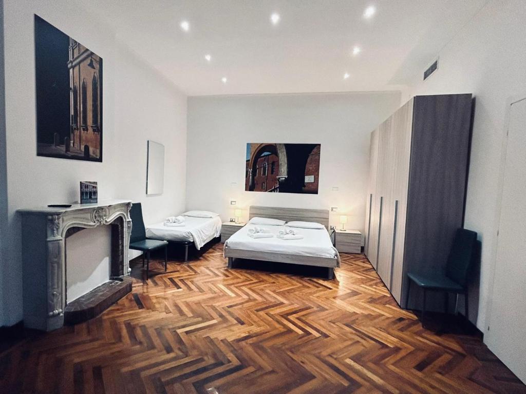 Postel nebo postele na pokoji v ubytování Centro Storico Suites