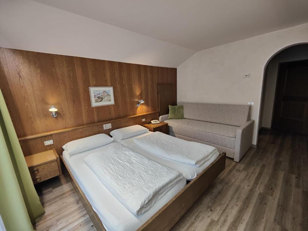 Postel nebo postele na pokoji v ubytování Hotel Alpenblick