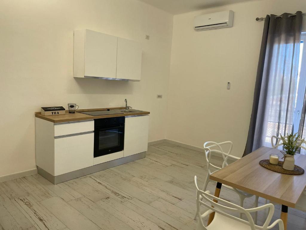 Kuchyň nebo kuchyňský kout v ubytování Maison appartaments