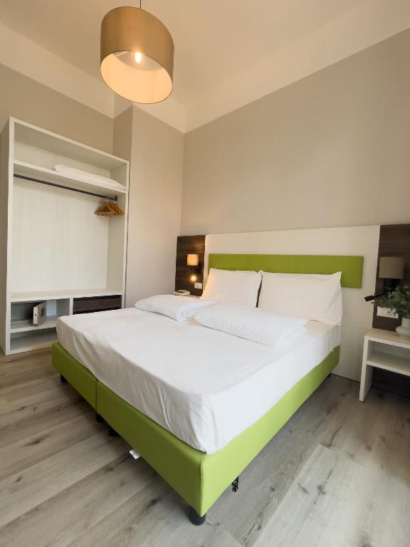 Postel nebo postele na pokoji v ubytování Hotel Benacus Torri del Benaco