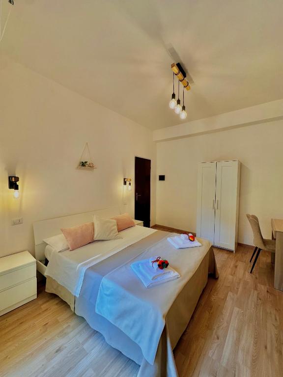 a bedroom with a bed with two plates on it at Sunflower apartment in Taormina