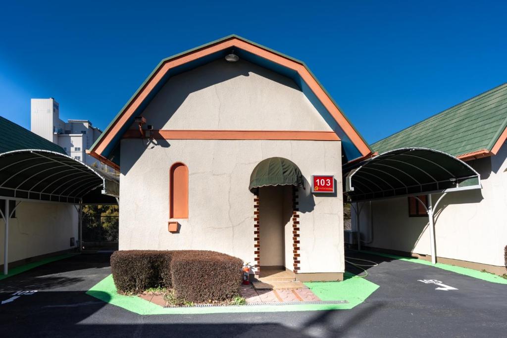 a model of a small building in a parking lot at Grand Hotel Narita Airport - Vacation STAY 56469v in Narita