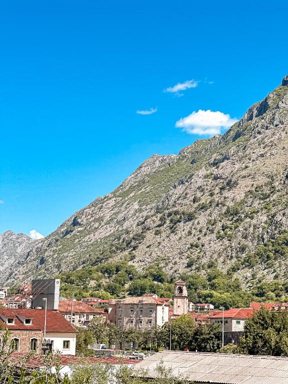 a town in front of a mountain at Venera Apartman in Škaljari