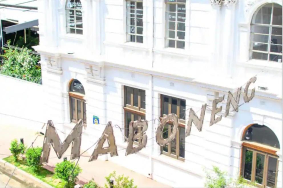 a white building with a sign that reads miami at Studio bliss @maboneng in Johannesburg