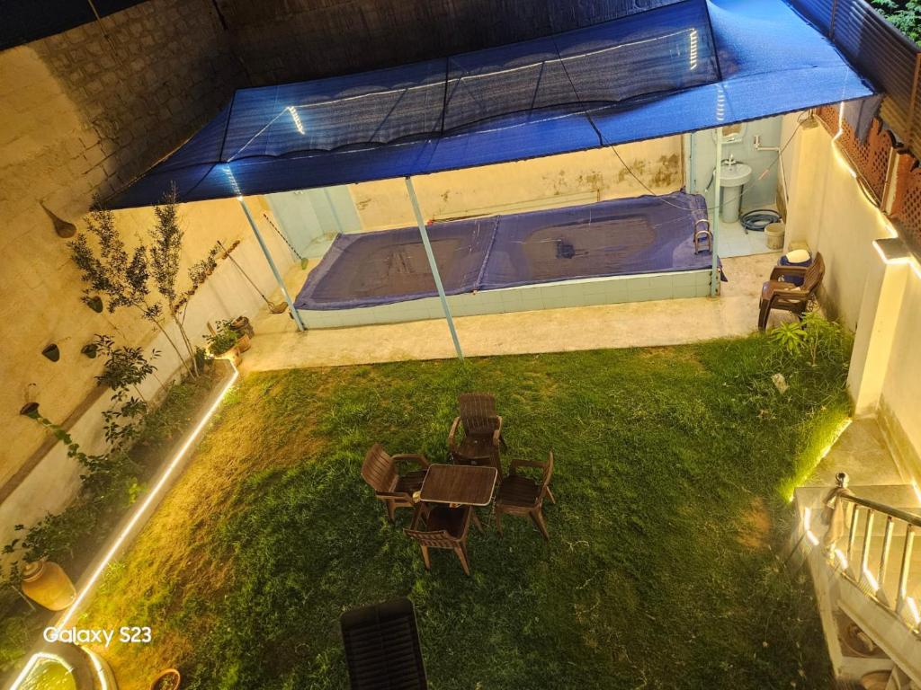 an overhead view of a backyard with a swimming pool at Syed Rest House in Karachi