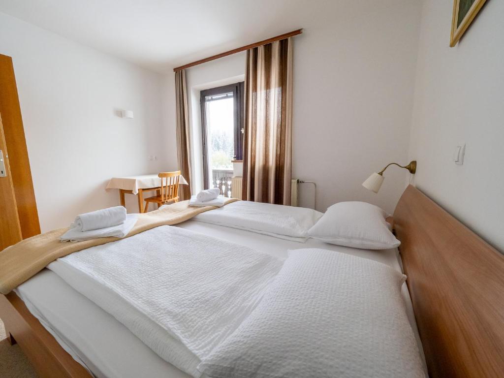 Postel nebo postele na pokoji v ubytování Apartments Škantar