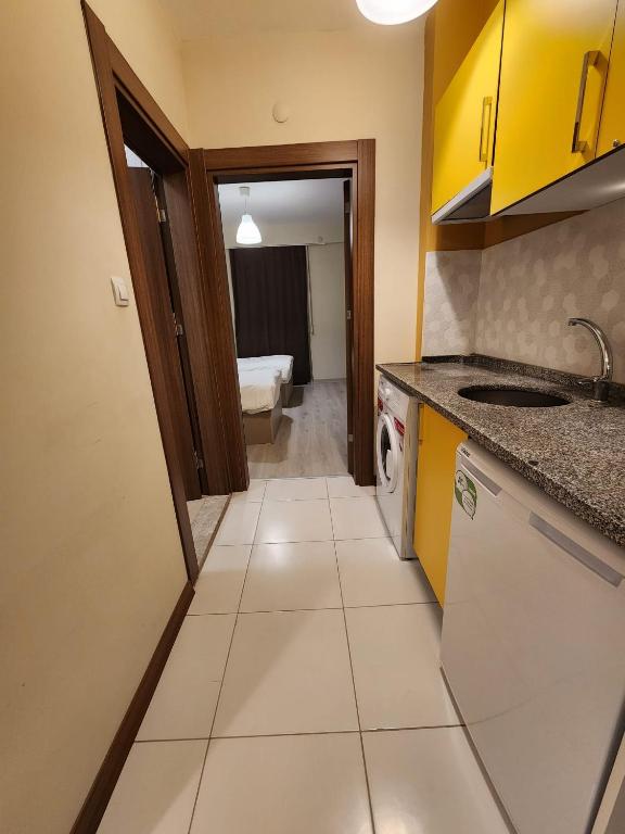 Kuchyň nebo kuchyňský kout v ubytování Moda Hotel