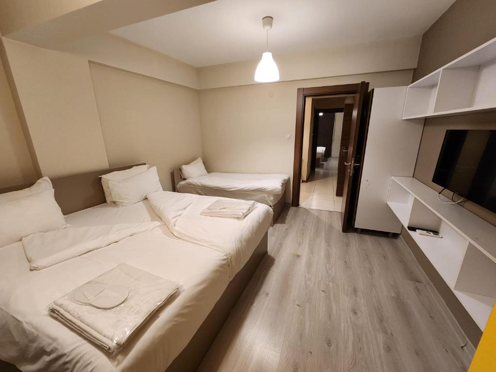 Postel nebo postele na pokoji v ubytování Moda Hotel