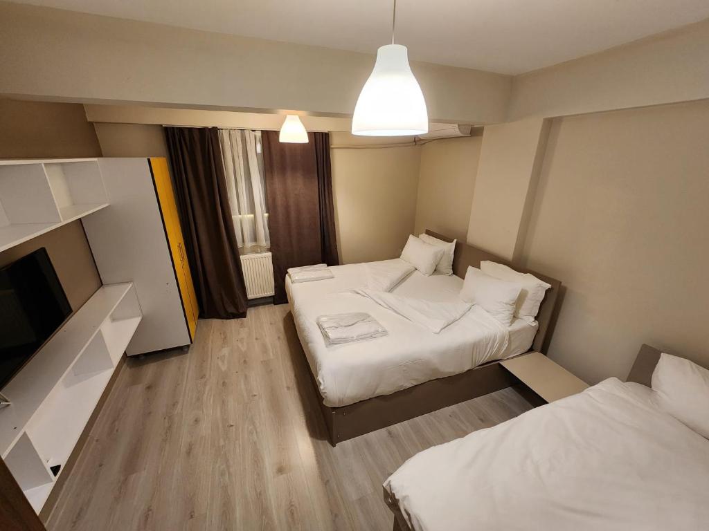 Postel nebo postele na pokoji v ubytování Moda Hotel