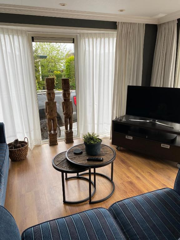 TV a/nebo společenská místnost v ubytování Vakantiewoning Maiva - Chaletparc Krabbenkreek