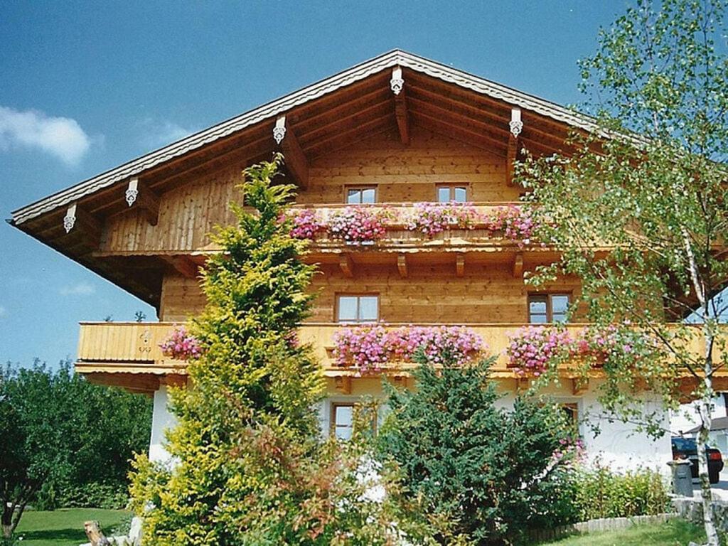a building with flowers on the side of it at Pleasant apartment in Bavaria in Neureichenau