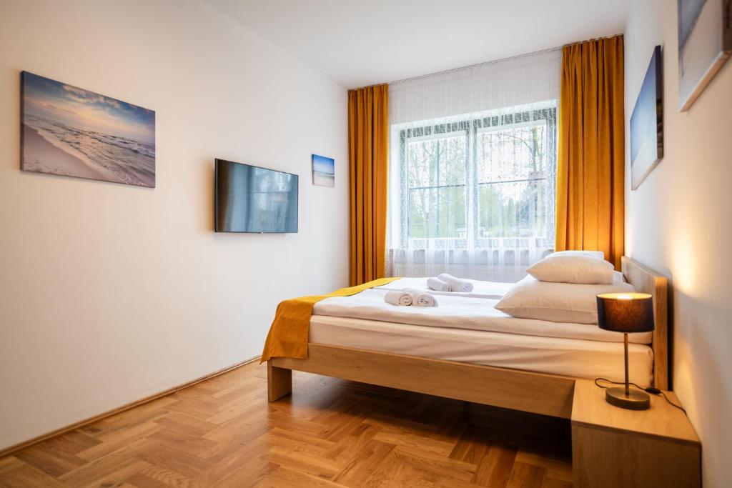 Postel nebo postele na pokoji v ubytování Willa Aga