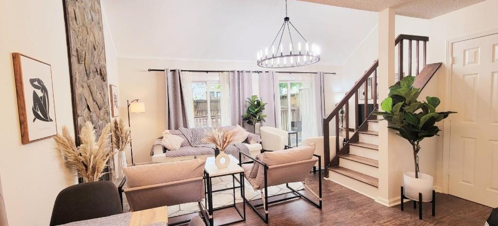 a living room with a couch and a table at Amin residence in Atlanta