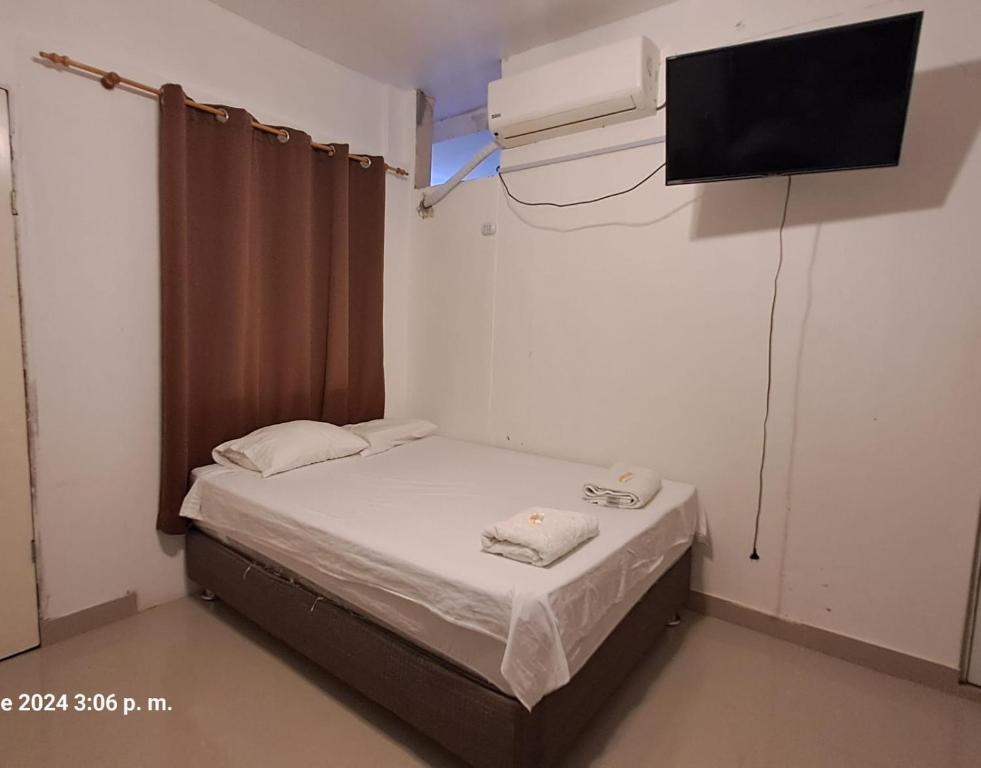 Postel nebo postele na pokoji v ubytování Hotel Hoskins Talara cerca centro, refinería