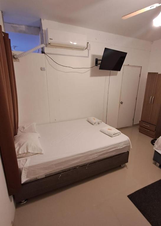 Postel nebo postele na pokoji v ubytování Hotel Hoskins Talara cerca centro, refinería