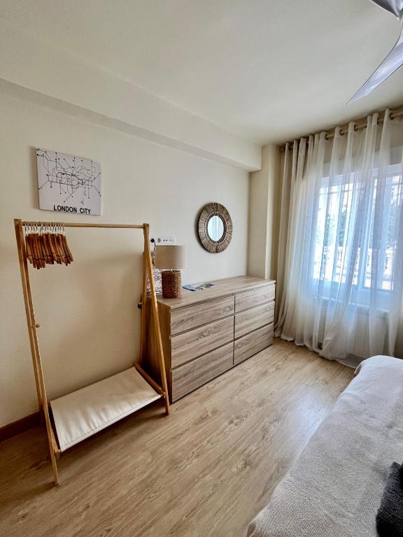 Postel nebo postele na pokoji v ubytování SANTA BARBARA APARTAMENTO