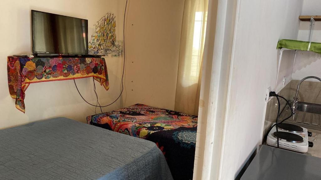 Postel nebo postele na pokoji v ubytování bungalow cactus frente ala playa