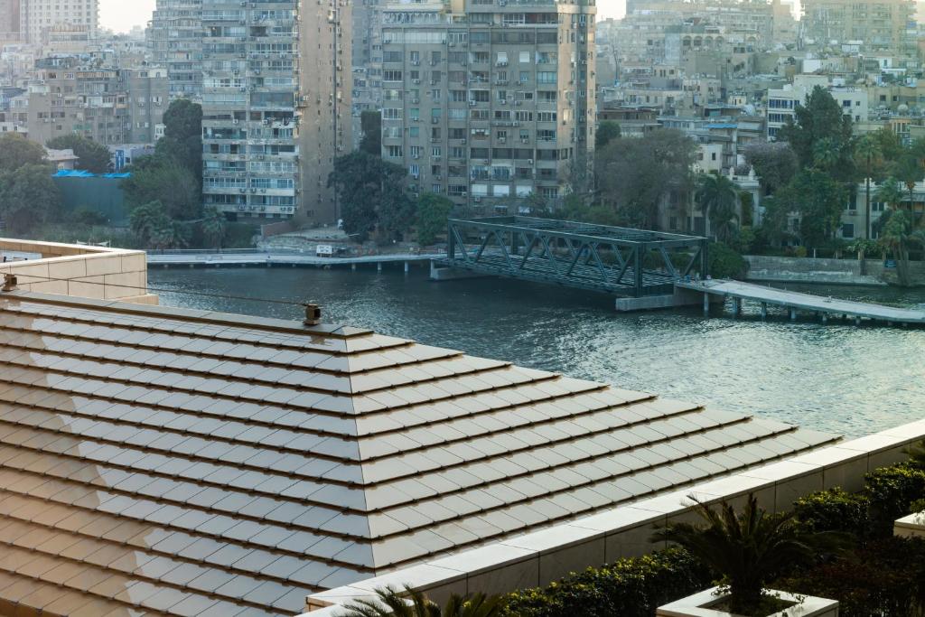 a view of a river in a city with buildings at the best charming condo on the Nile in Cairo