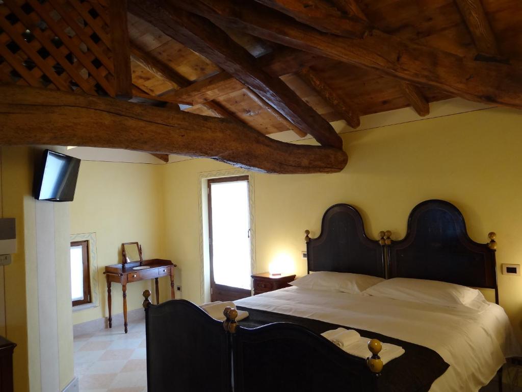 Postel nebo postele na pokoji v ubytování Le Camere Della Bice