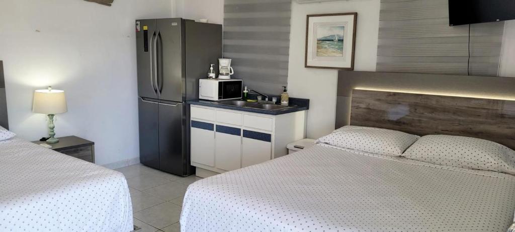 Postel nebo postele na pokoji v ubytování Playa Apartments