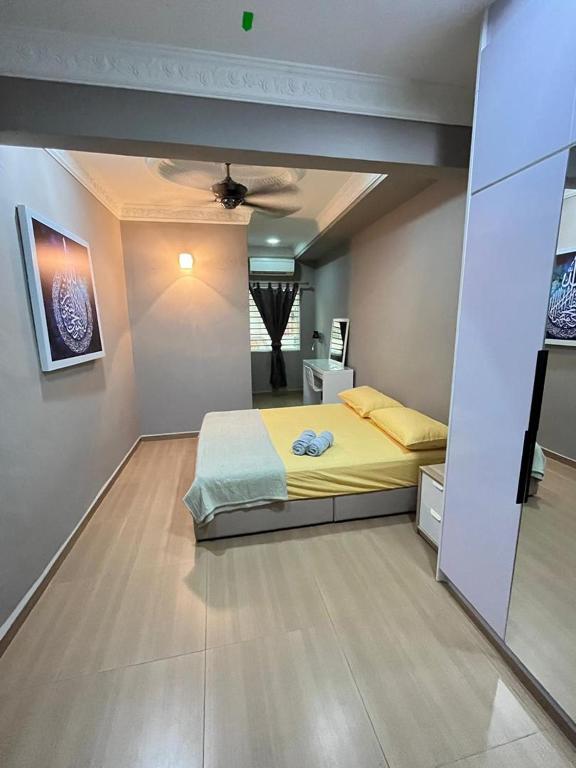 Postel nebo postele na pokoji v ubytování Iwan Ila Homestay