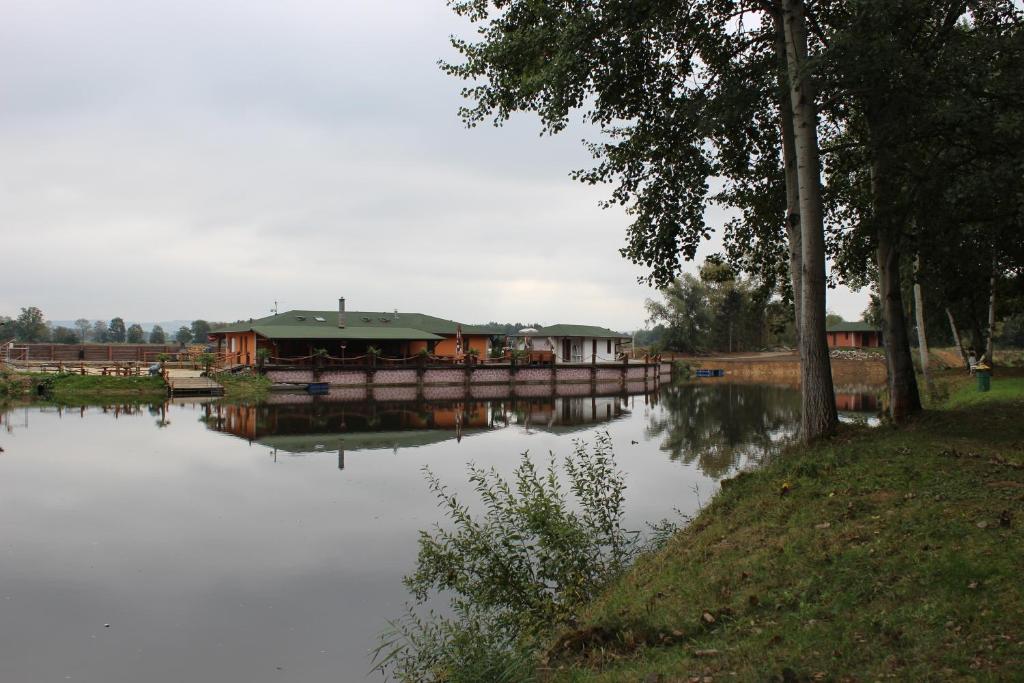 a house on a bridge over a body of water at Marine Závlahy in Hrdějovice