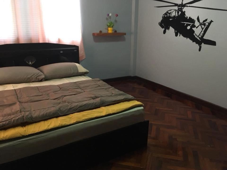 a bedroom with a bed with a helicopter on the wall at The Jeffy Pool Villa in Chanthaburi