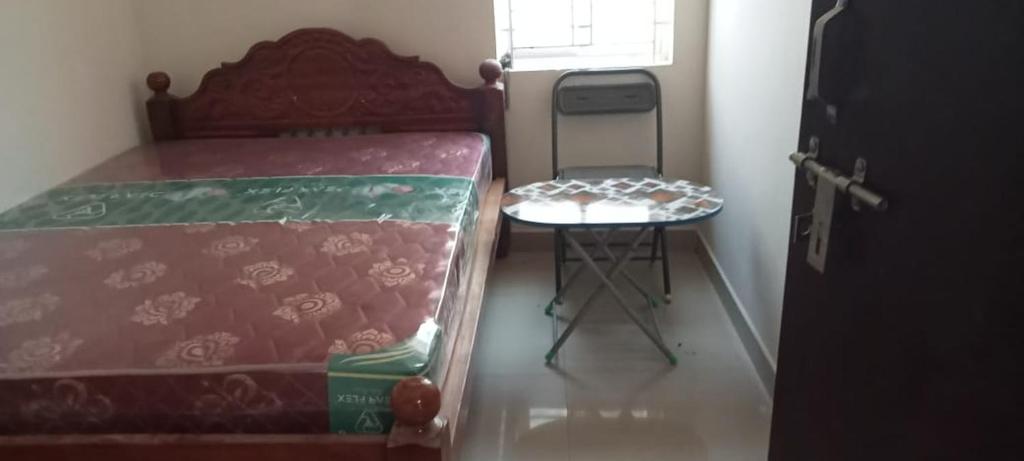 Postel nebo postele na pokoji v ubytování Hallima Residency NKS LODGE