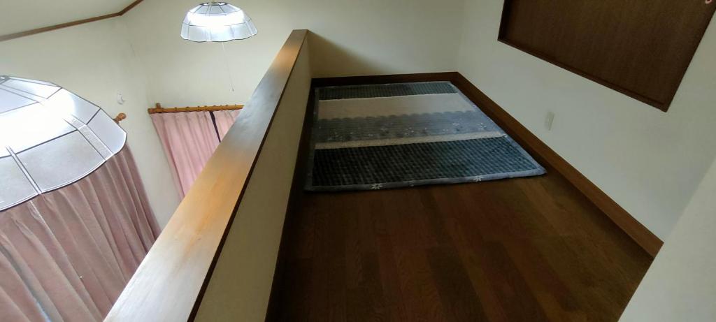 an overhead view of a bowling alley in a room at Home Stay 北国分 in Ichikawa