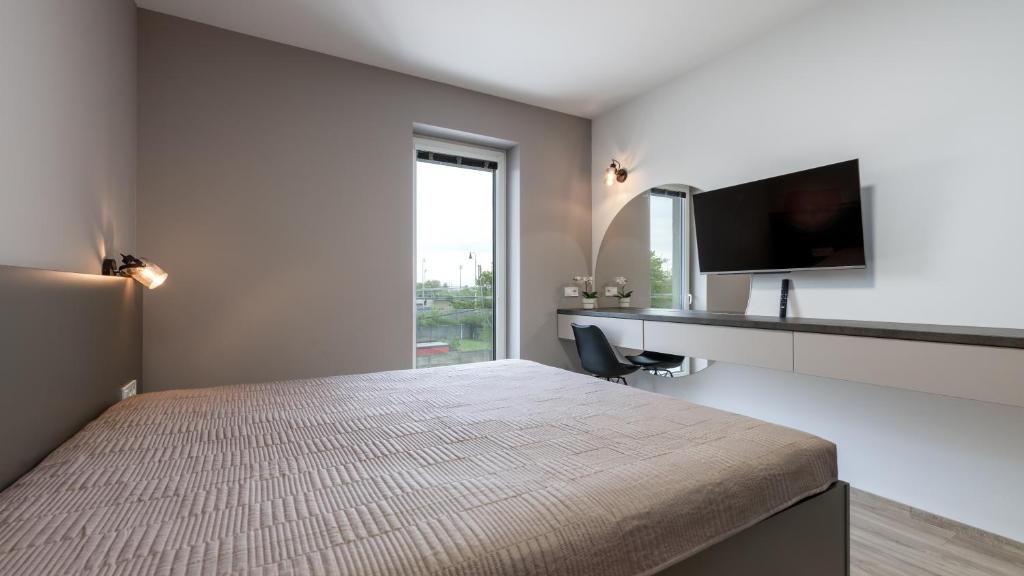 Postel nebo postele na pokoji v ubytování AV apart hotel