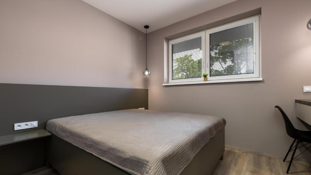Postel nebo postele na pokoji v ubytování AV apart hotel