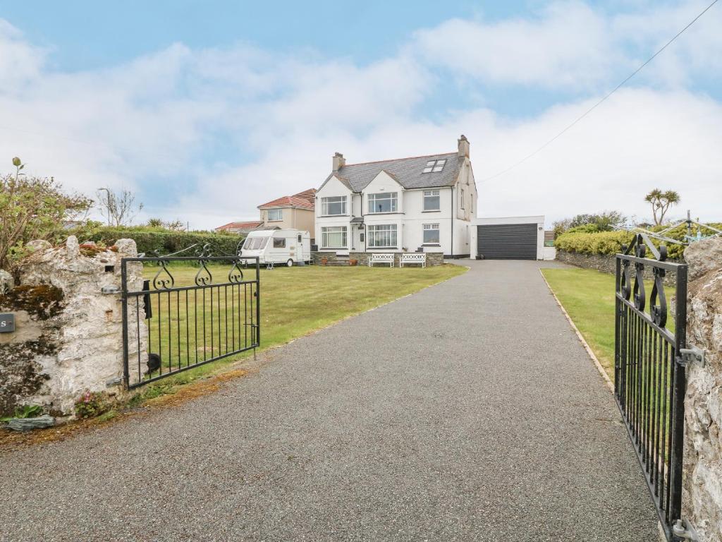 a house with a gate and a fence at Gables Retreat in Trearddur