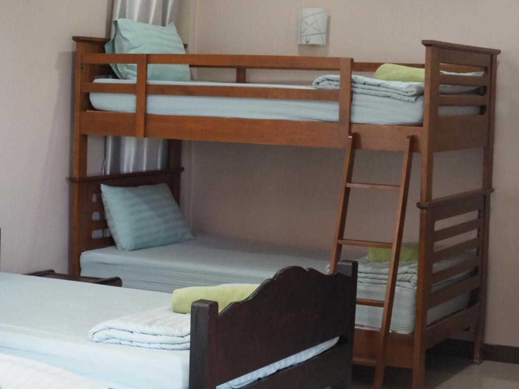 Postel nebo postele na pokoji v ubytování บ้านชมเขา - Baan Chom Khao