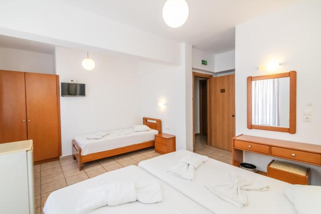 Postel nebo postele na pokoji v ubytování Ageri Hotel