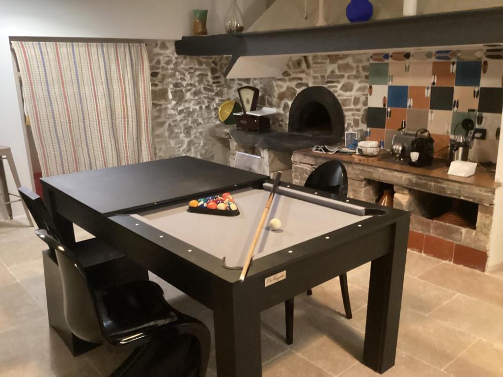 a ping pong table in the middle of a kitchen at LOFT AUTHENTIQUE 3 STARS Terrasse VIEUX PORT in La Ciotat