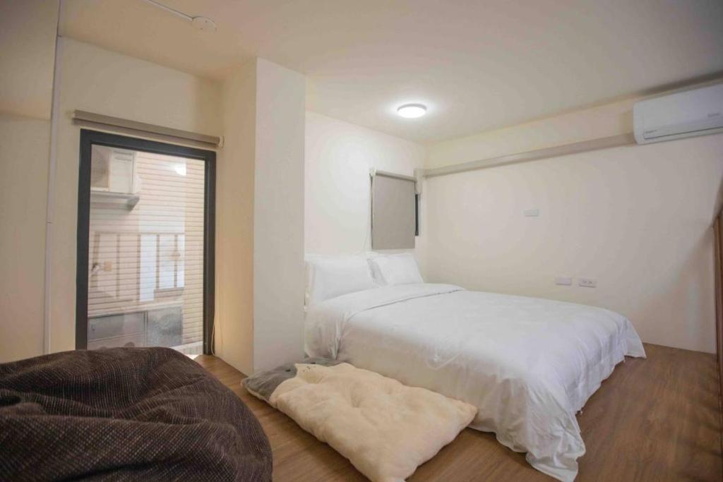 Postel nebo postele na pokoji v ubytování Xianwang Homestay
