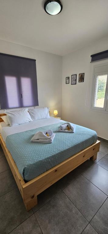 Ένα ή περισσότερα κρεβάτια σε δωμάτιο στο heaven suite elafonisi