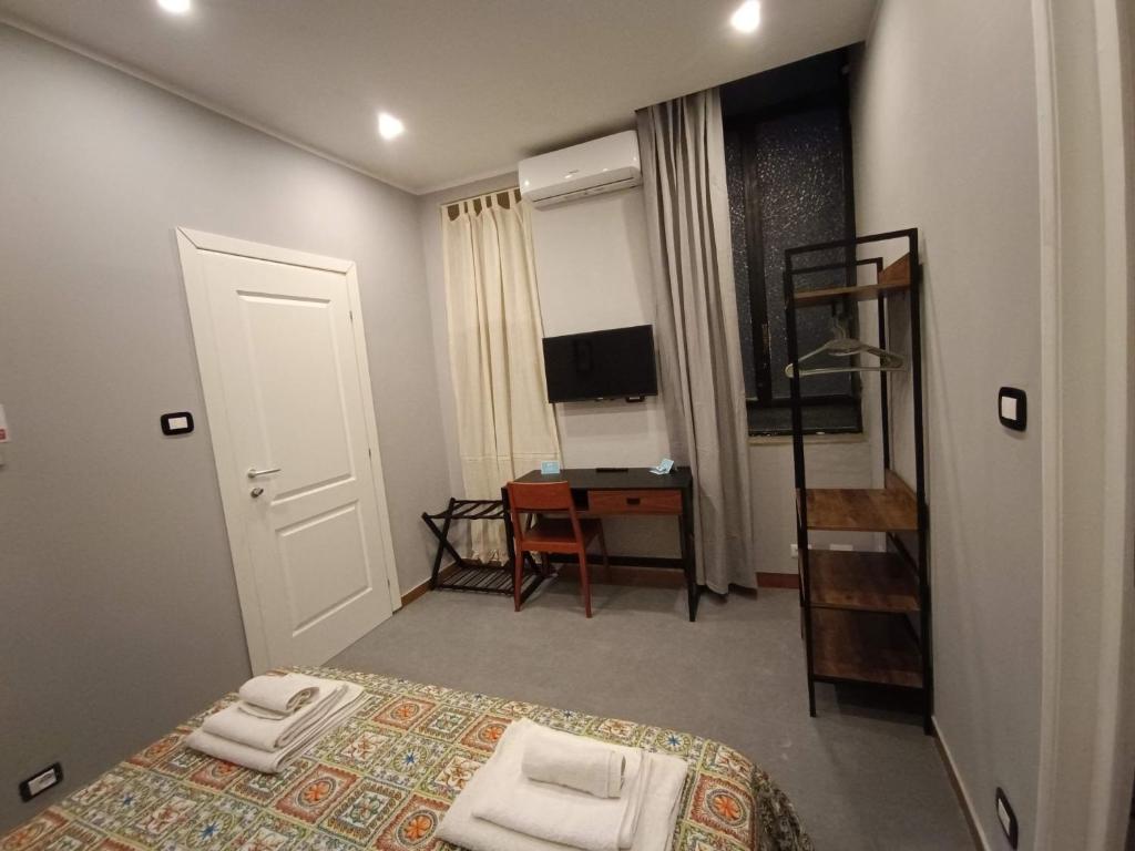 TV a/nebo společenská místnost v ubytování Il Genio del Porto - Mabbonath b&b