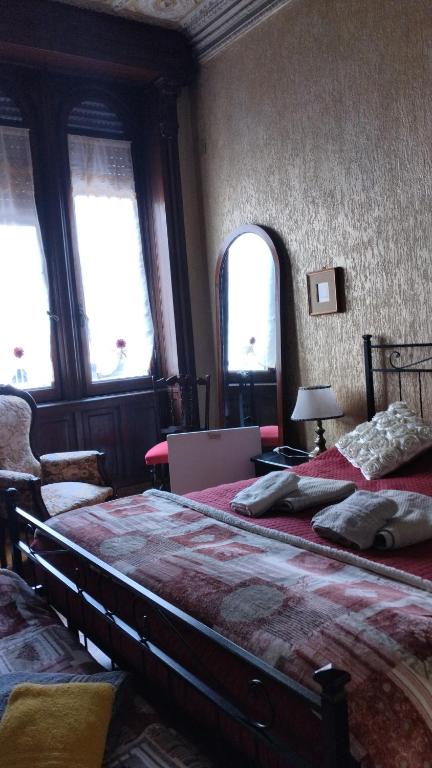 Postel nebo postele na pokoji v ubytování B&B Amarantha Gothica Genoa