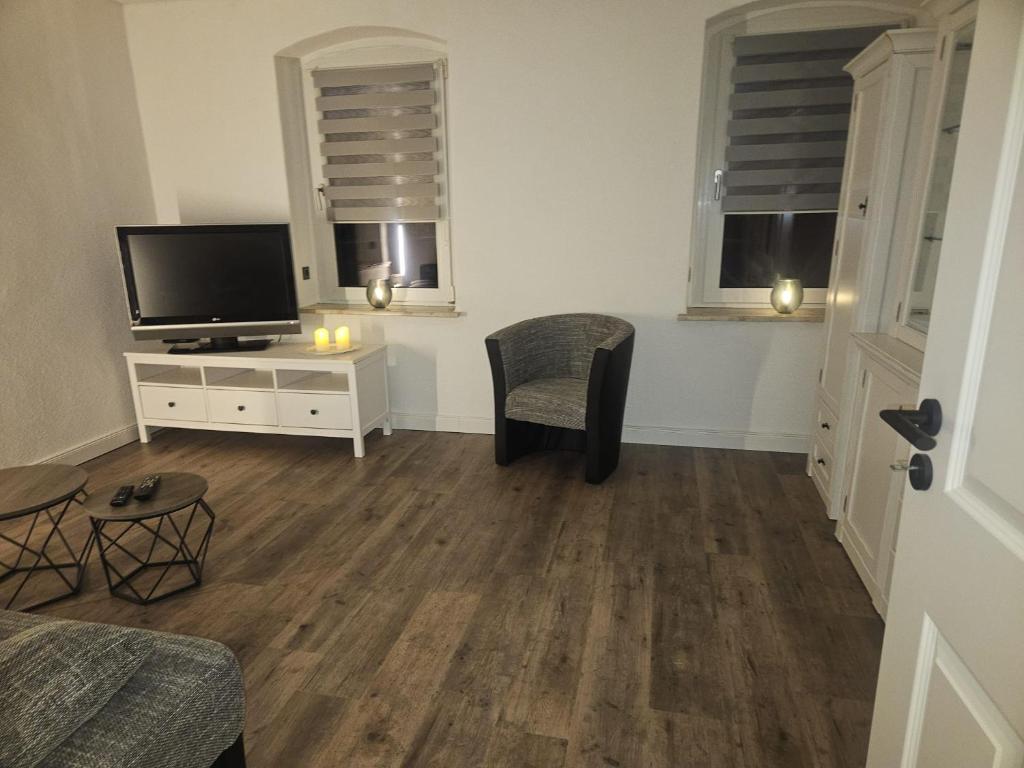 TV a/nebo společenská místnost v ubytování Ferienwohnung Grimma