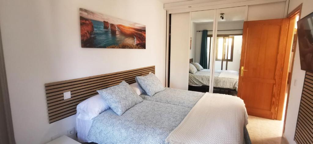 Postel nebo postele na pokoji v ubytování Arinaga Beach Gran Canaria