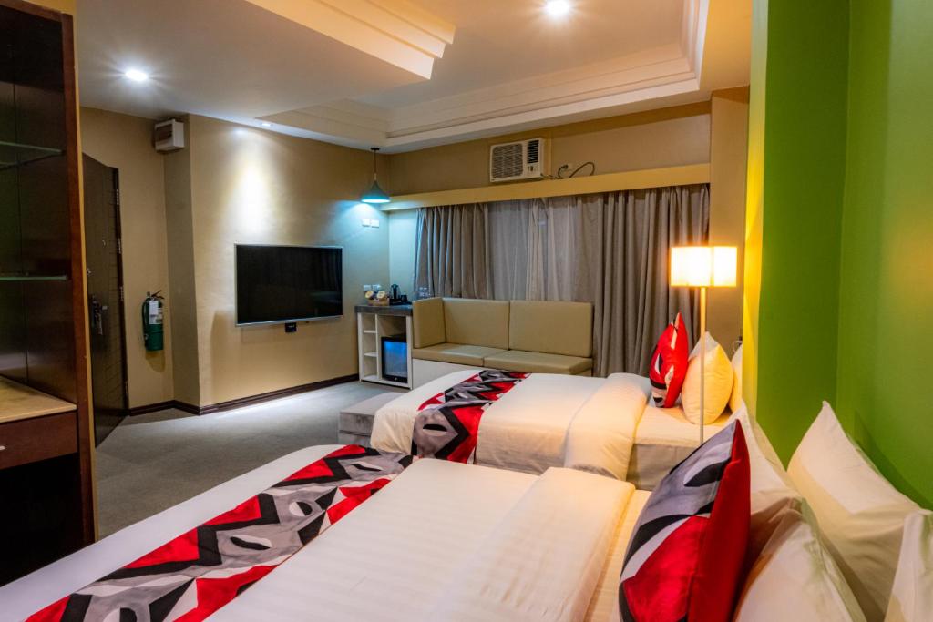 Postel nebo postele na pokoji v ubytování Kojo Hotels Cebu-Mandaue