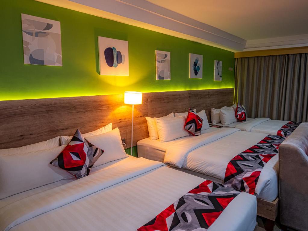 Postel nebo postele na pokoji v ubytování Kojo Hotels Cebu-Mandaue
