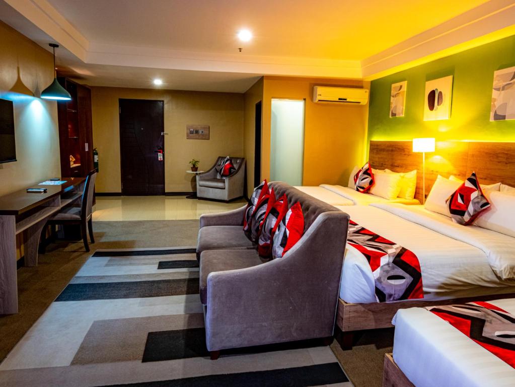 Postel nebo postele na pokoji v ubytování Kojo Hotels Cebu-Mandaue