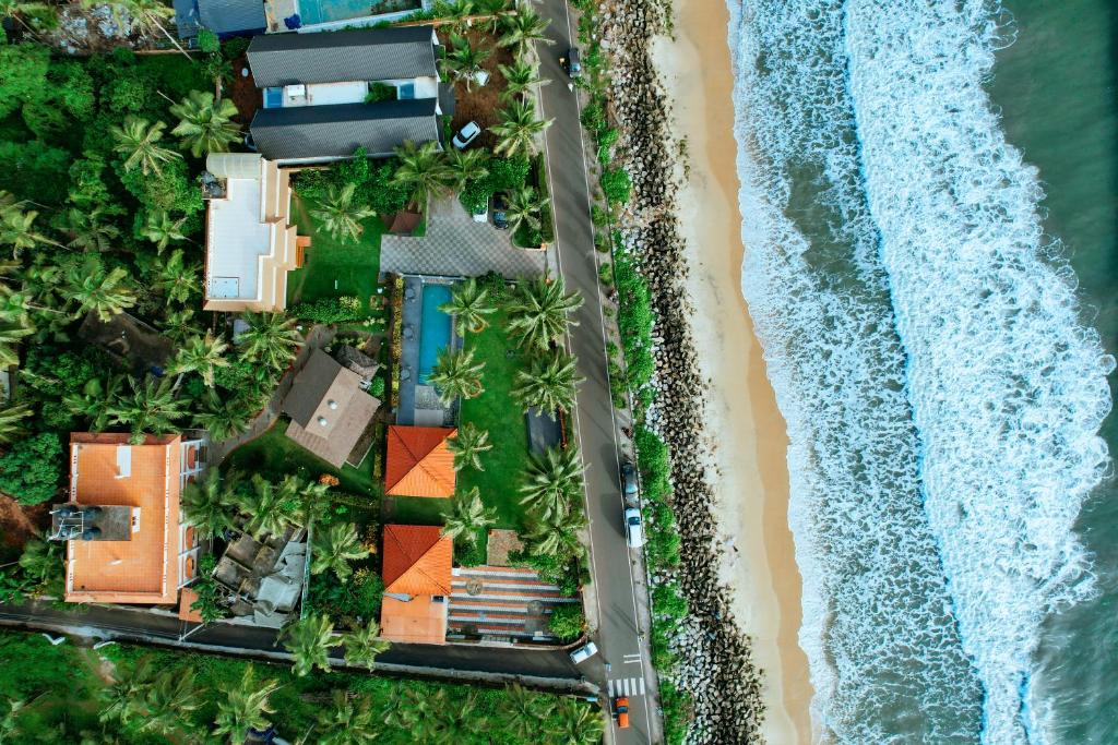an overhead view of the beach and the ocean at Asokam Beach Resort in Kannur