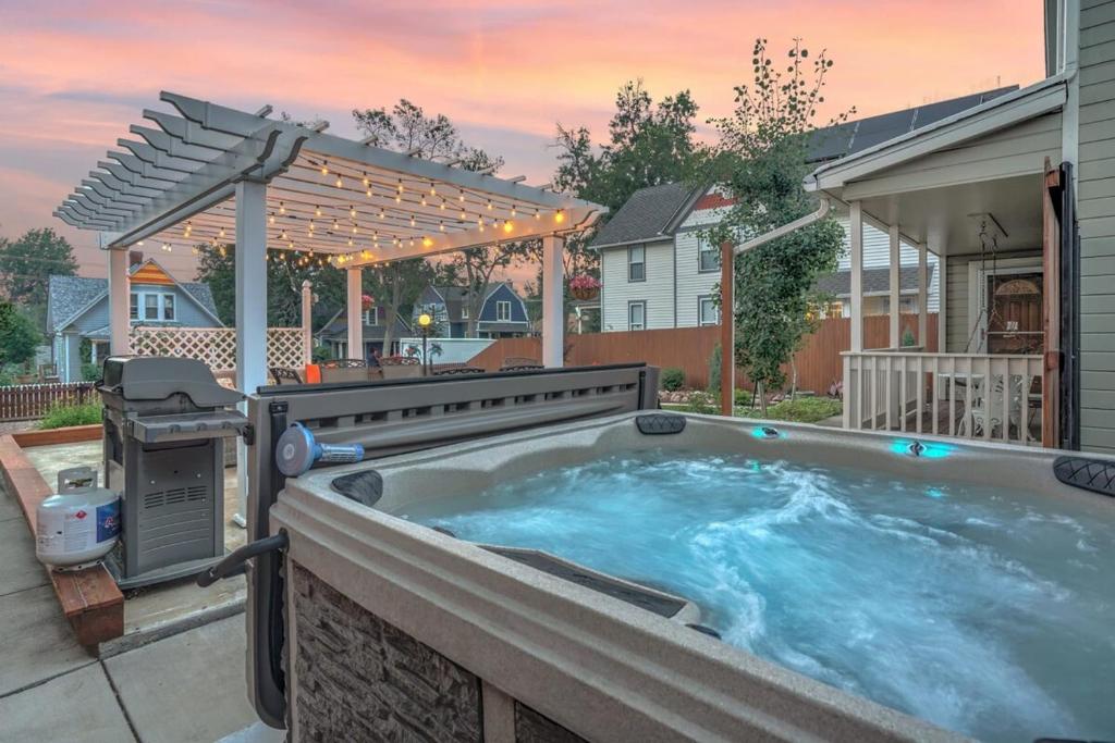 a hot tub in a backyard with a pergola at 3BR DOWNTOWN - NEW Hot Tub - Olympic Training Center in Colorado Springs