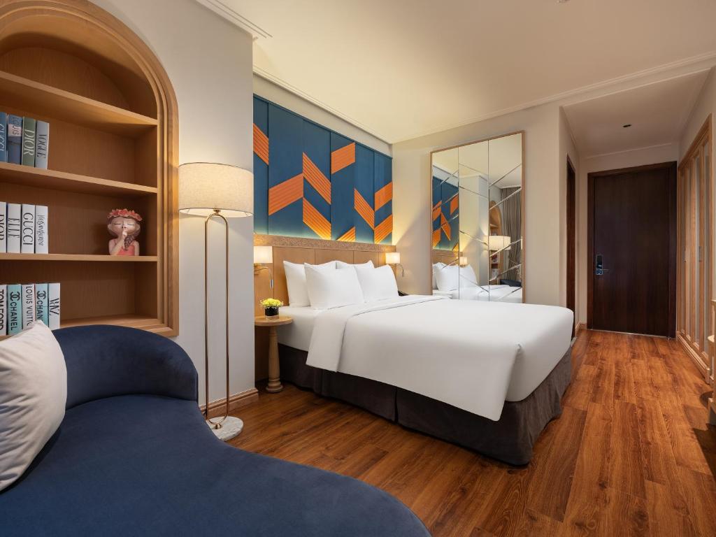 Postel nebo postele na pokoji v ubytování Saigon Aroma Hotel