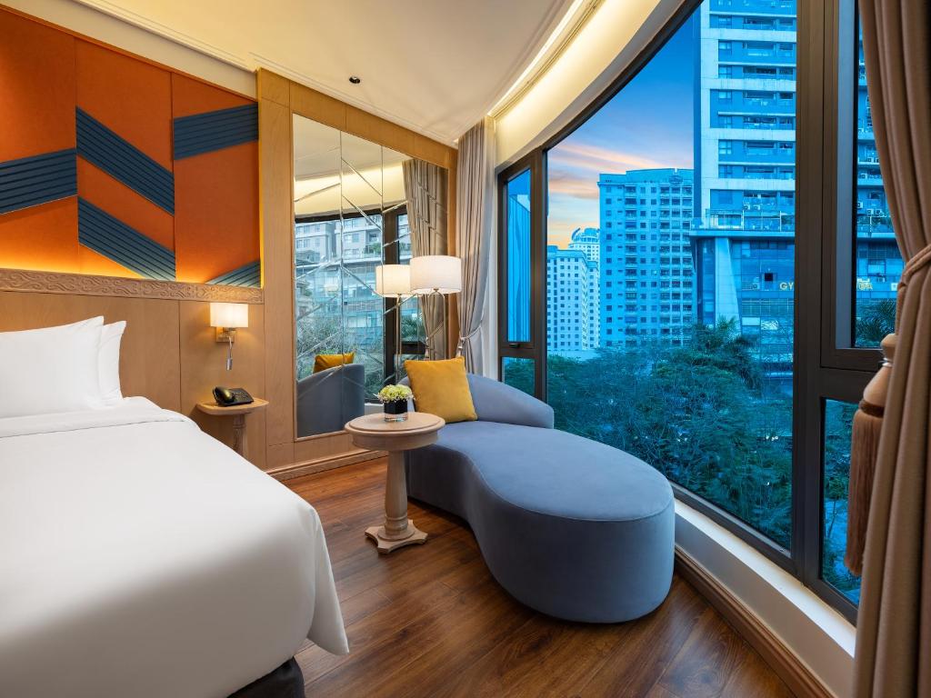 Postel nebo postele na pokoji v ubytování Saigon Aroma Hotel