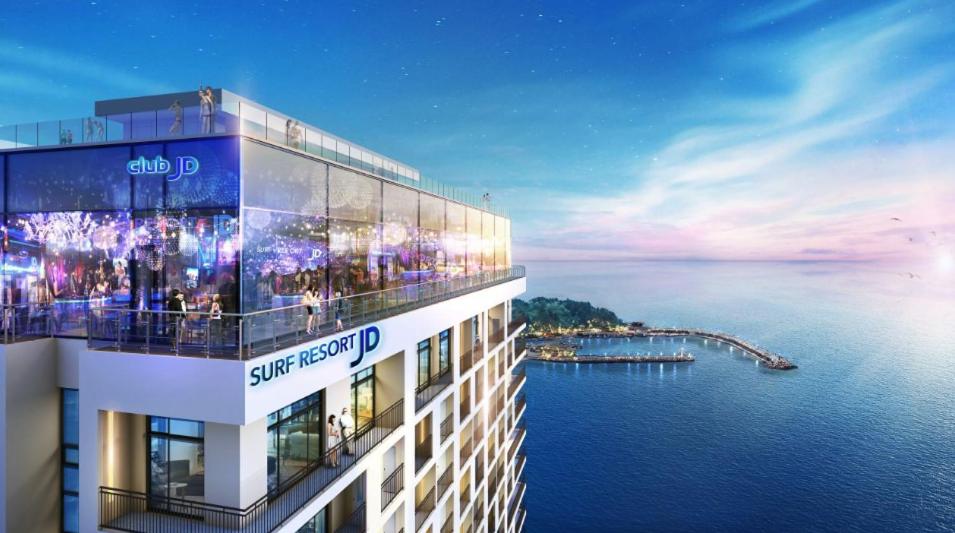 a rendering of a building with a view of the water at Surf Resort JD Yangyang in Yangyang